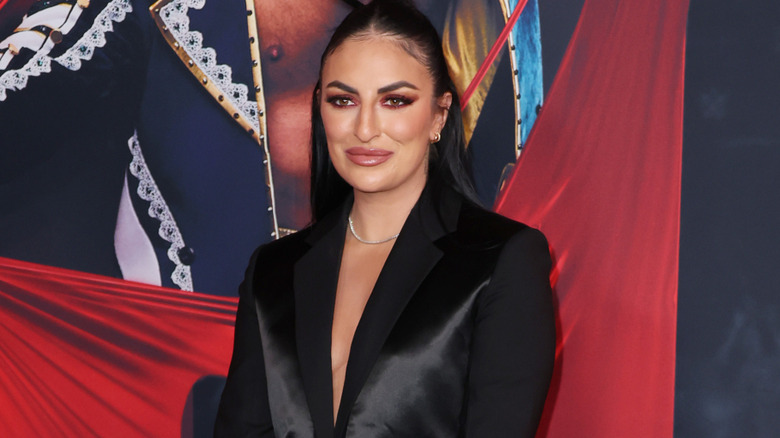 Sonya Deville wearing a black blazer