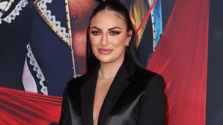 Sonya Deville wearing a black blazer