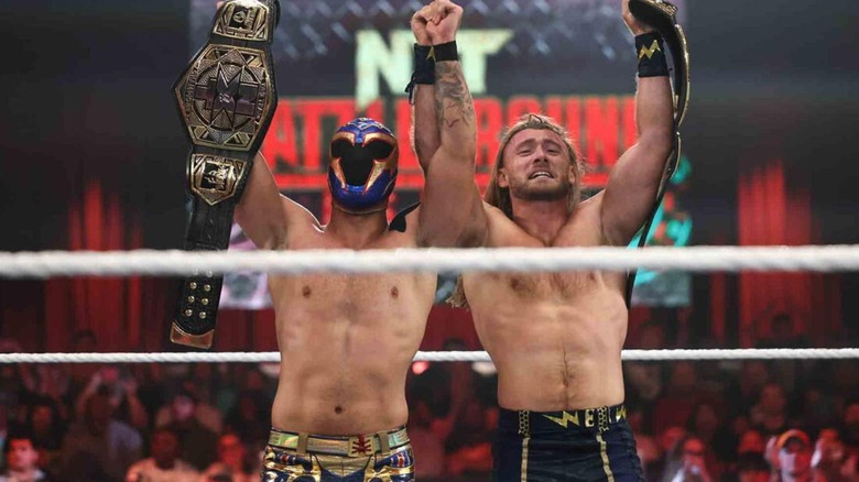 Axiom and Nathan Frazer hold up the NXT Tag Team Championships after winning at 