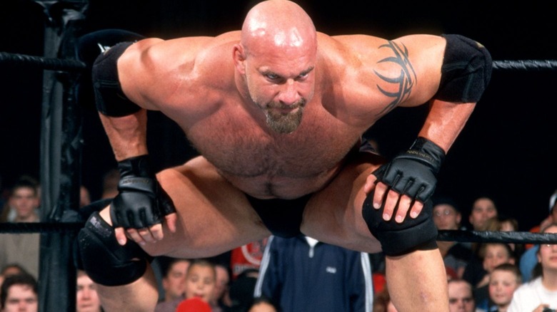 Goldberg prepares to deliver a spear in a WWE ring.