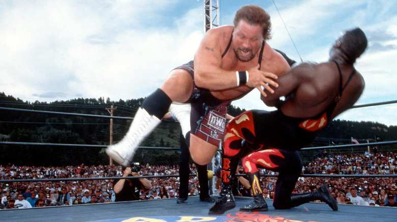 Scott Norton tackles Booker T at WCW Road Wild