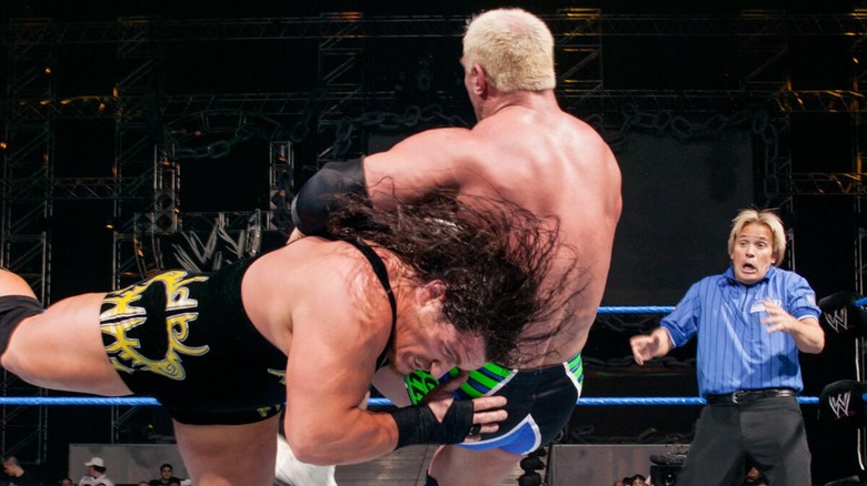 Rhyno hitting Harcore Holly with The Gore