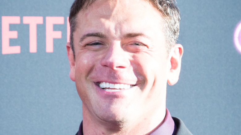 Alex Riley posing on the red carpet