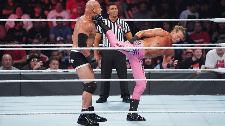 Dolph Ziggler delivers a super kick to Goldberg 