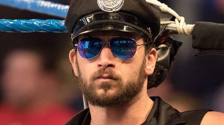 Fandango in the ring dressed as a policeman 