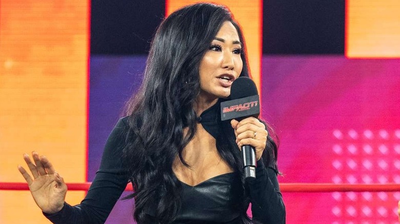 Gail Kim holding a TNA Wrestling microphone in the ring