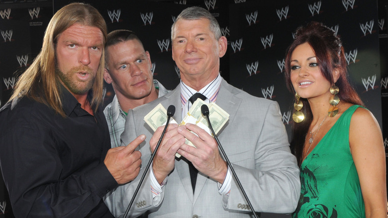 Triple H, John Cena, Vince McMahon, and Maria Kanellis