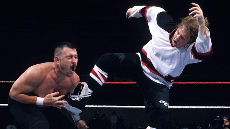 Wild Bill Irwin as "The Goon" kicks his opponent in the gut