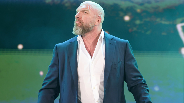 Triple H wearing a suit