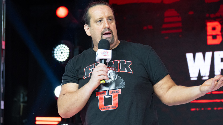 Tommy Dreamer talking into microphone