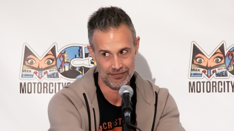 Freddie Prinze Jr. sitting at mic desk