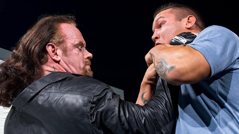 Undertaker chokes Randy Orton