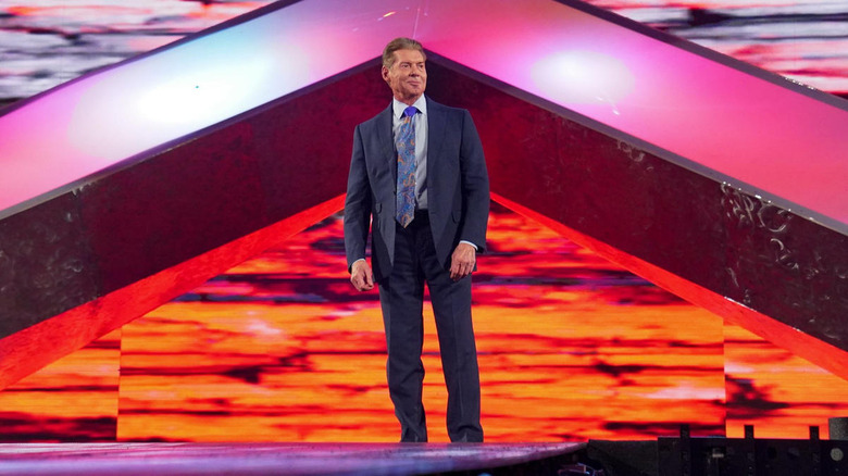Vince McMahon stands