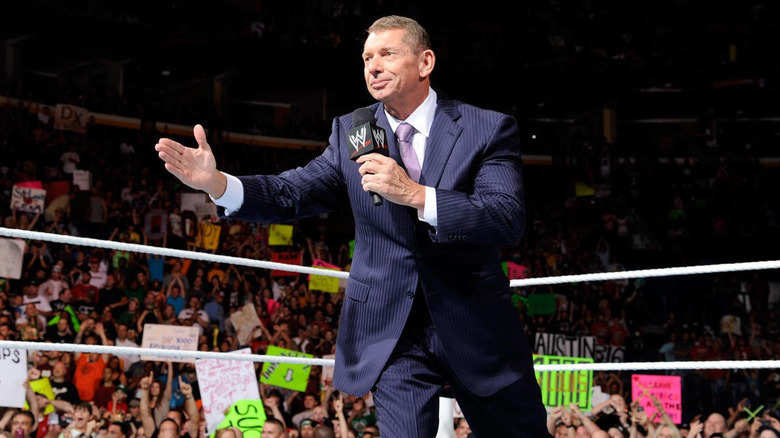 Vince McMahon extends hand