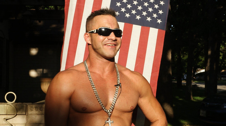 Teddy Hart in front of an American flag