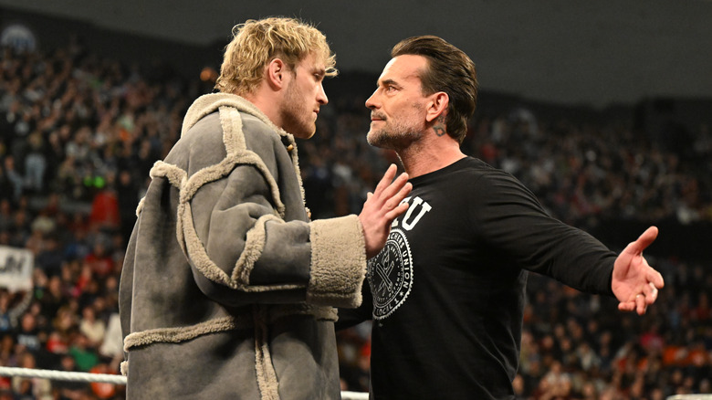 Logan Paul and CM Punk face off during Monday Night RAW at Heritage Bank Center on February 24, 2025 in Cincinnati, Ohio