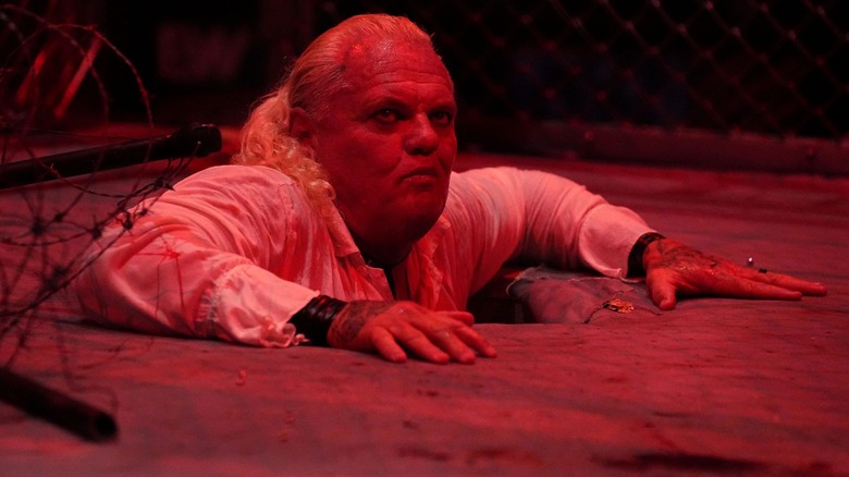Gangrel appears from under the ring