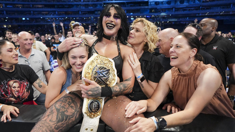 Rhea Ripley celebrates with her title in the crowd