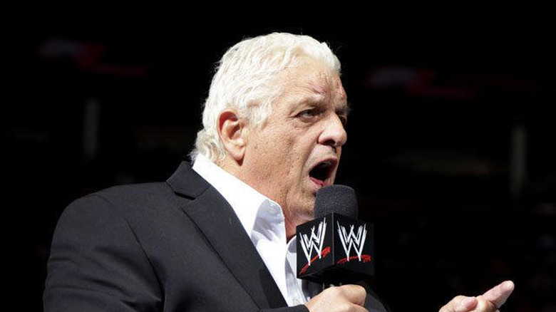 The late Dusty Rhodes speaking into a WWE microphone