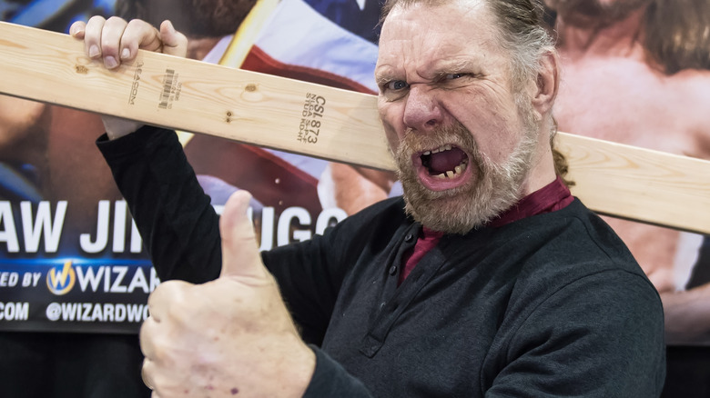 Jim Duggan holds 2x4