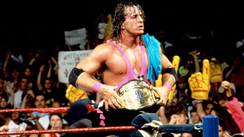 Bret Hart posing with a world title 