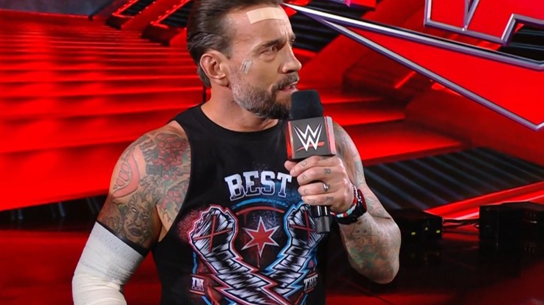 CM Punk speaking into microphone