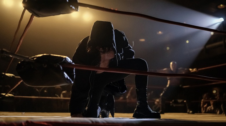 The Condamned kneels in the ring 