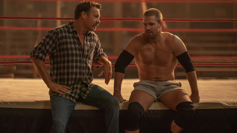 Tom and Jack sitting on the ring apron