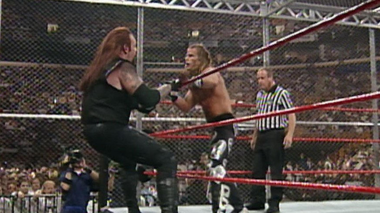 Undertaker and HBK hang on ropes