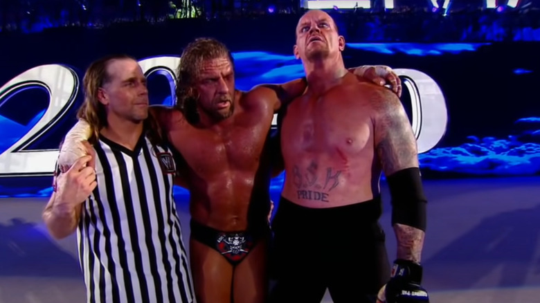 Triple H arms around HBK Undertaker
