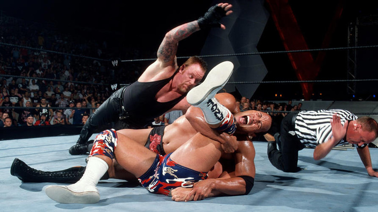 The Rock pinning Kurt Angle