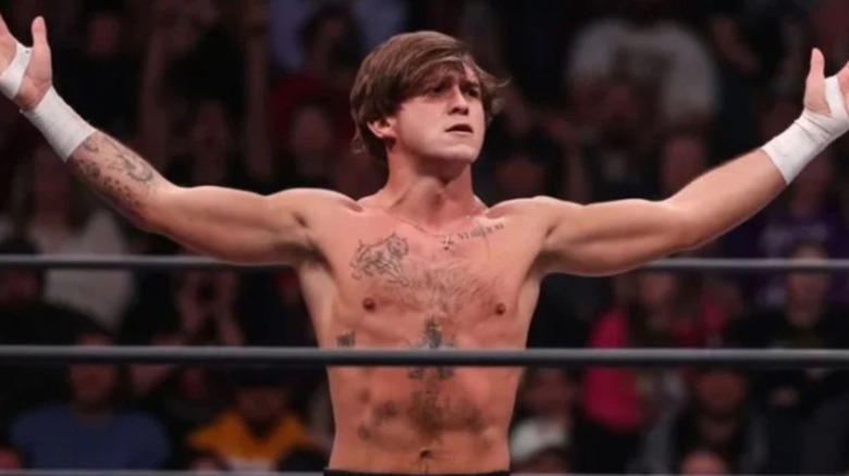 HOOK raises his arms and poses in the middle of the ring during an episode of AEW TV.