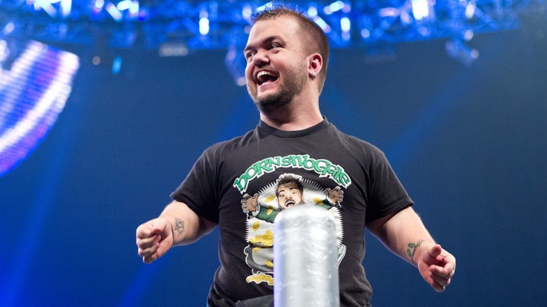 Hornswoggle standing on a turnbuckle