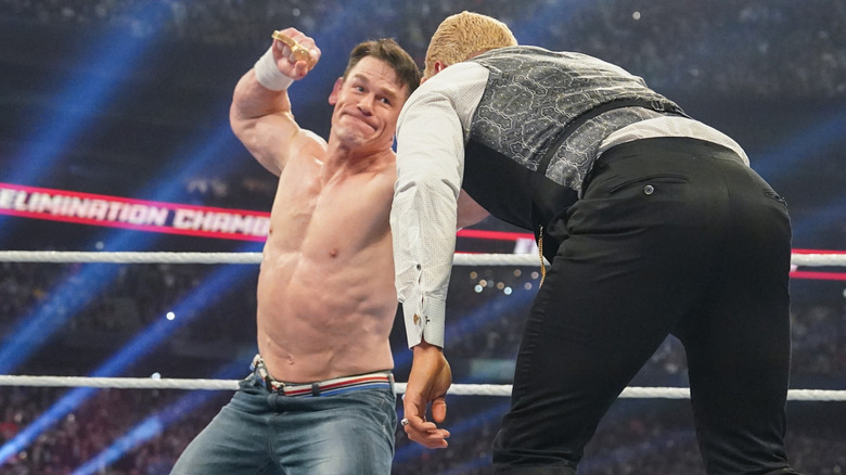 John Cena hitting Cody Rhodes with a Rolex watch at WWE Elimination Chamber 2025