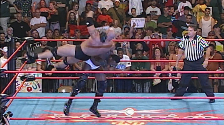 Booker T catches Goldberg in the Book End