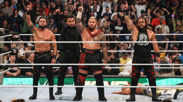 The Bloodline posing in the ring