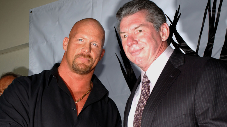 Vince McMahon posing with Steve Austin