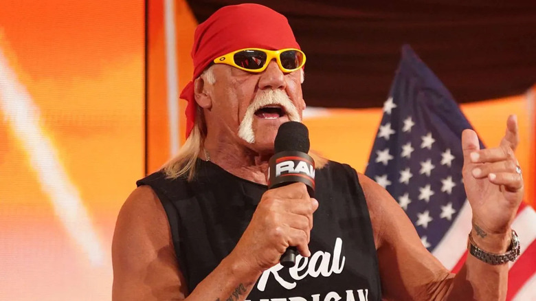 Hulk Hogan talks into the microphone during WWE Saturday Night's Main Event