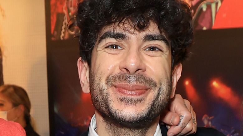 Tony Khan smiles