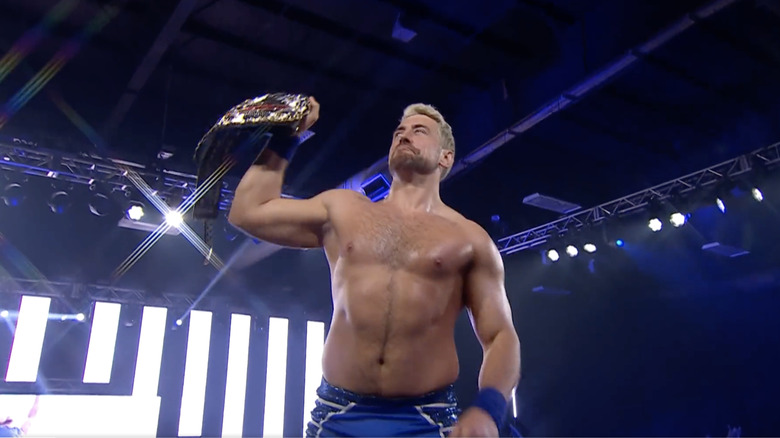 Joe Hendry holding up his title