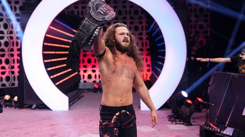 Jack Perry holding up TNT title