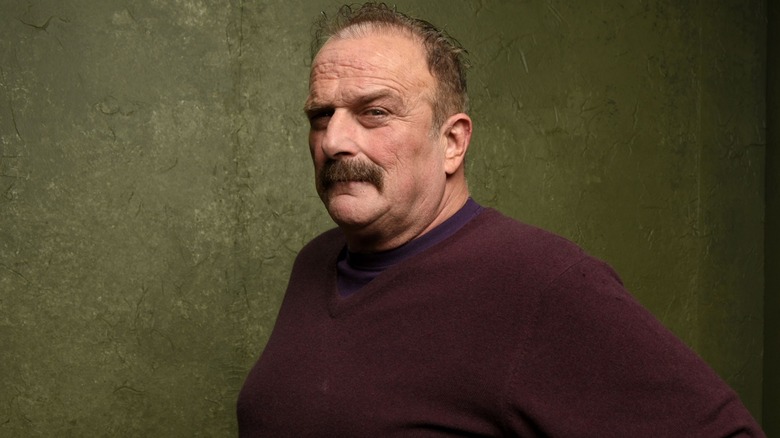 Jake Roberts looks on