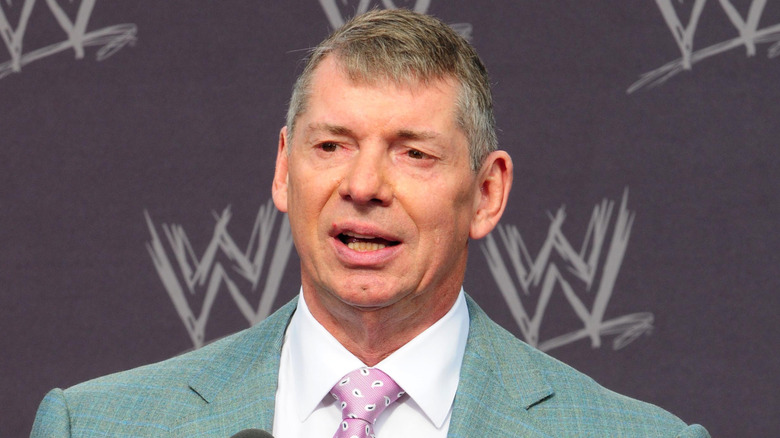 Vince McMahon in front of a WWE background