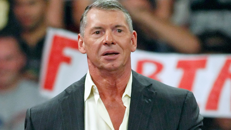 Vince McMahon standing in front of an audience