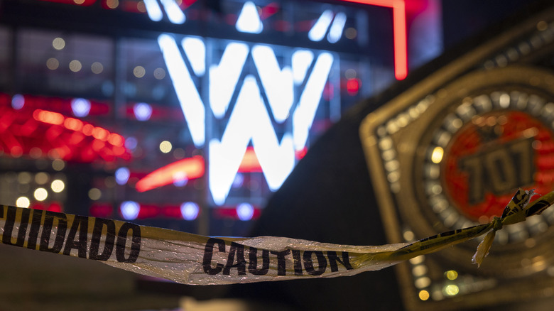 Caution tape in front of WWE logo