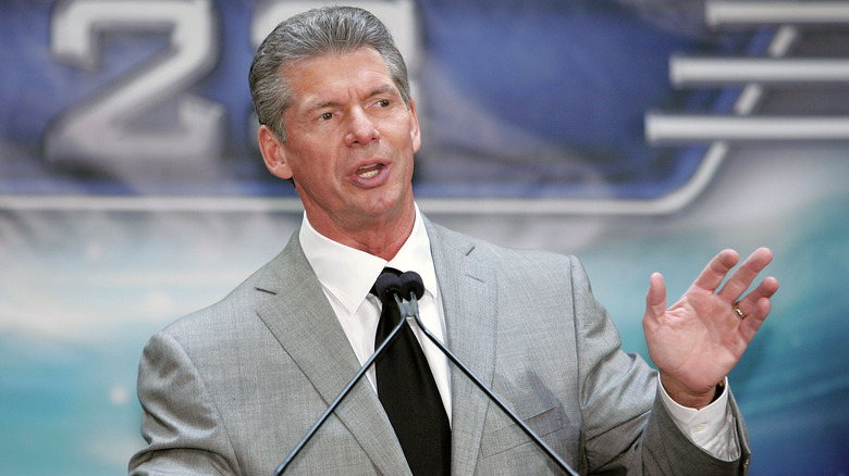 Vince McMahon speaking at a press conference