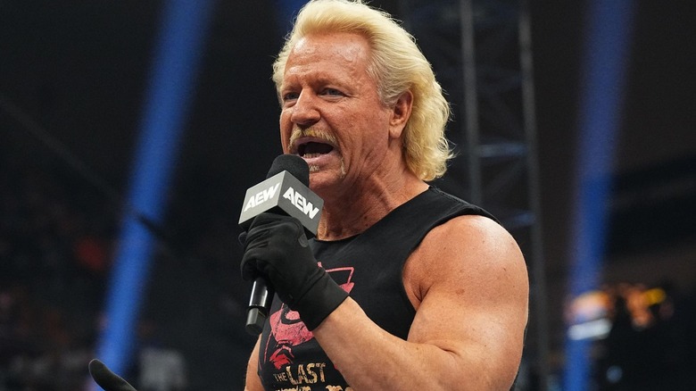 Jeff Jarrett holding a microphone