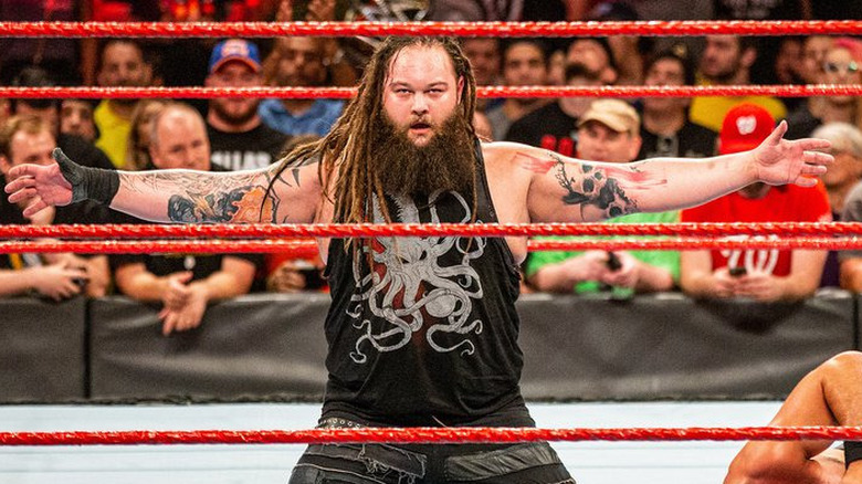The late Bray Wyatt posing in the middle of the ring on "WWE Raw"