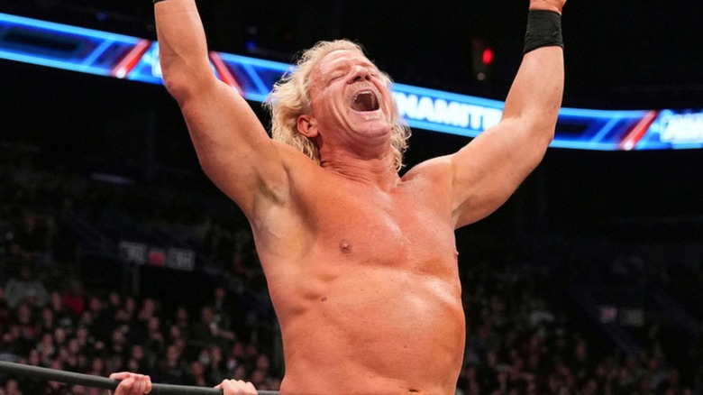 Jeff Jarrett raises his arms believing he's won