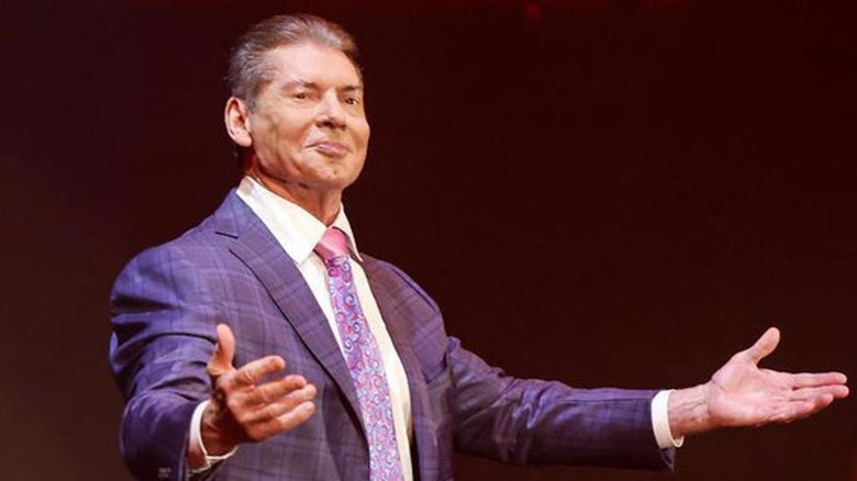 Vince McMahon with arms spread